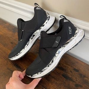 Tiem cycle shoes with cleats.